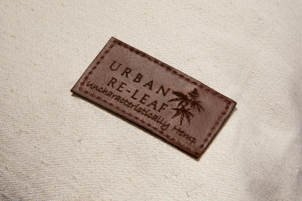 This is Urban Re-Leaf faux leather patch with the slogan uncharacteristically hemp.