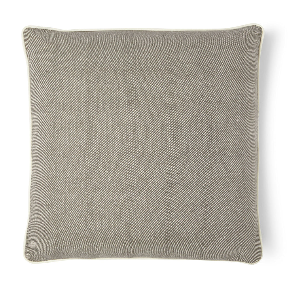You'll enjoy this hemp blended pillow in brown with a white piping around the pillow.