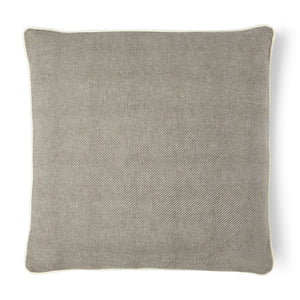 You'll enjoy this hemp blended pillow in brown with a white piping around the pillow.